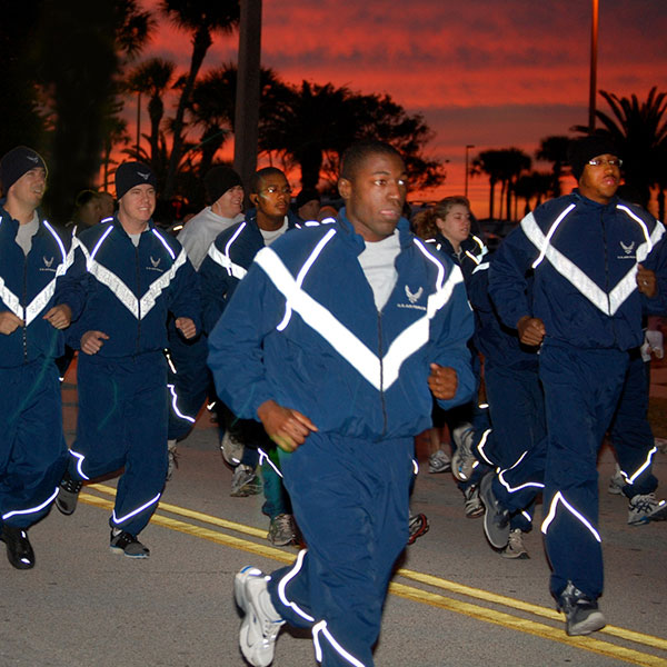 Young men running in track suits